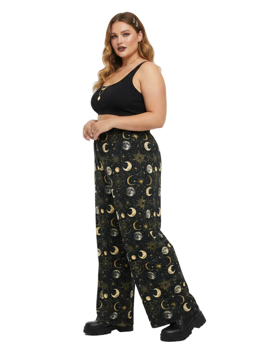 Woman wearing Whimsigoth celestial wide leg lounge pants with sun, moon, and star print.