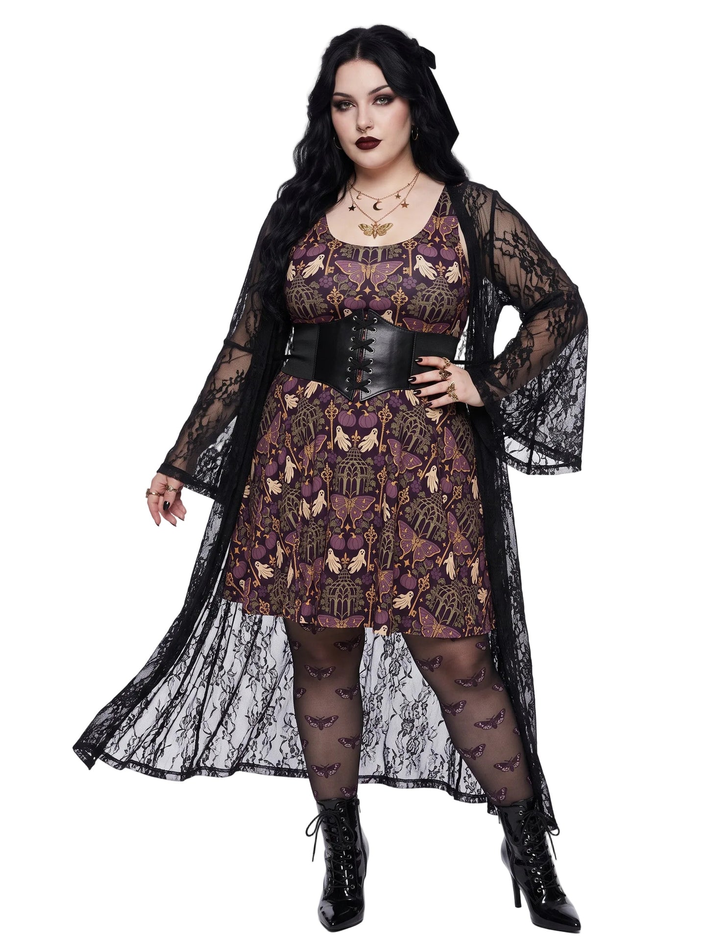 A woman modeling a gothic-style outfit featuring a purple patterned dress with moth detail, a black lace long coat, a black corset belt, patterned tights, and black lace-up boots.
