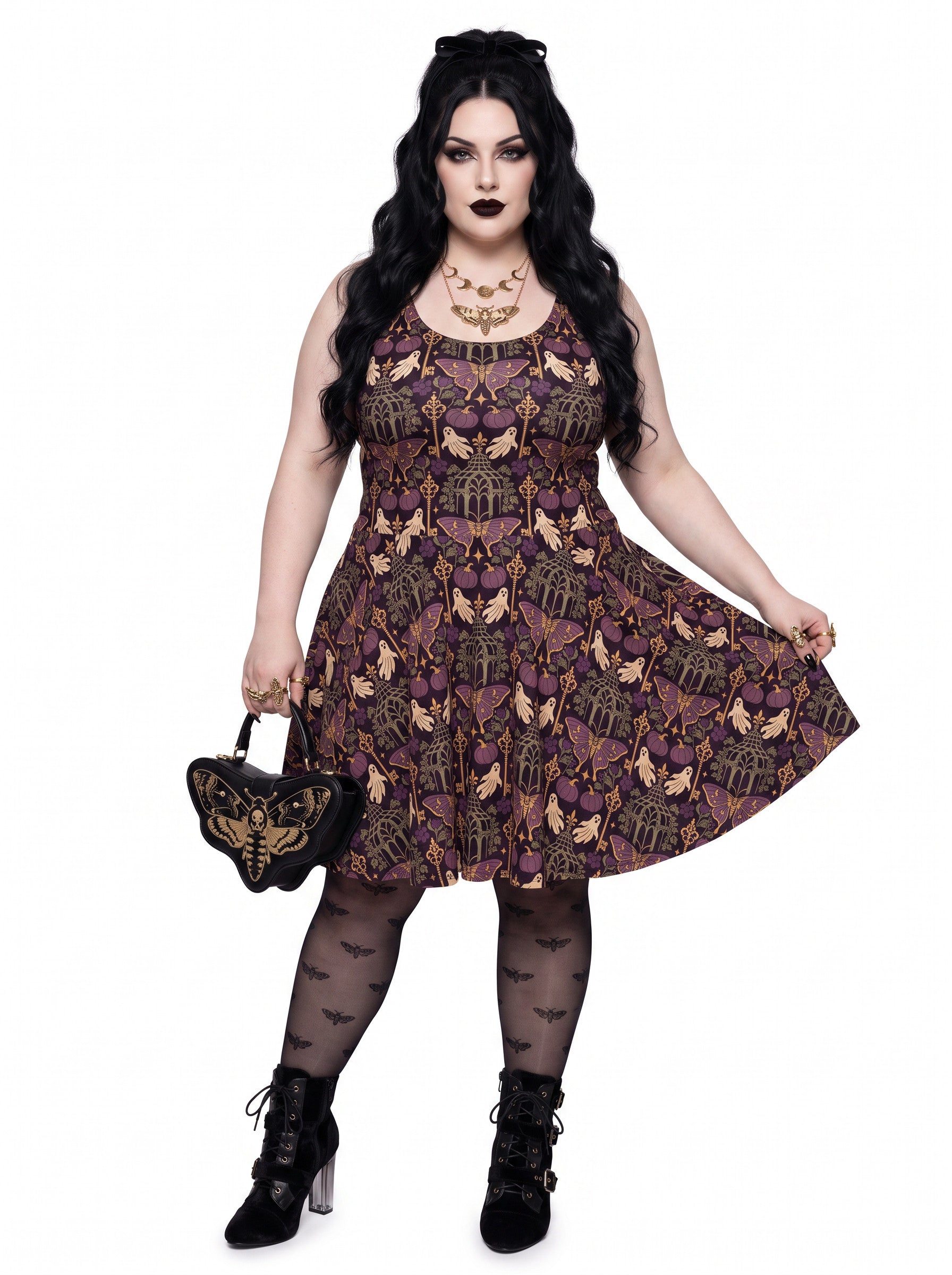 Plus size woman modeling a purple Whimsigoth gothic moth ghost skater dress with a fit and flare silhouette.