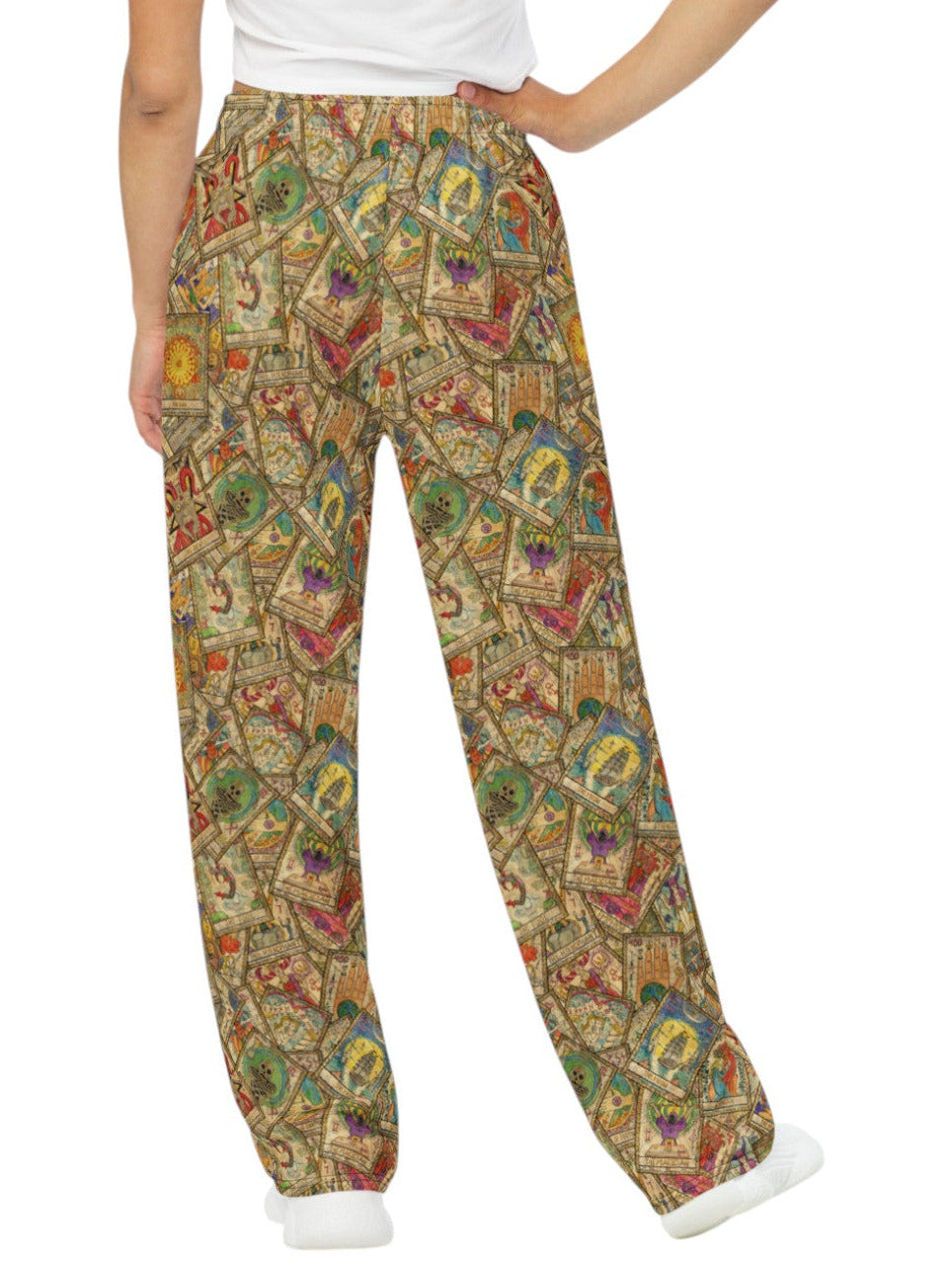 Woman wearing Whimsigoth wide leg lounge pants with vintage tarot card print and practical side pockets.