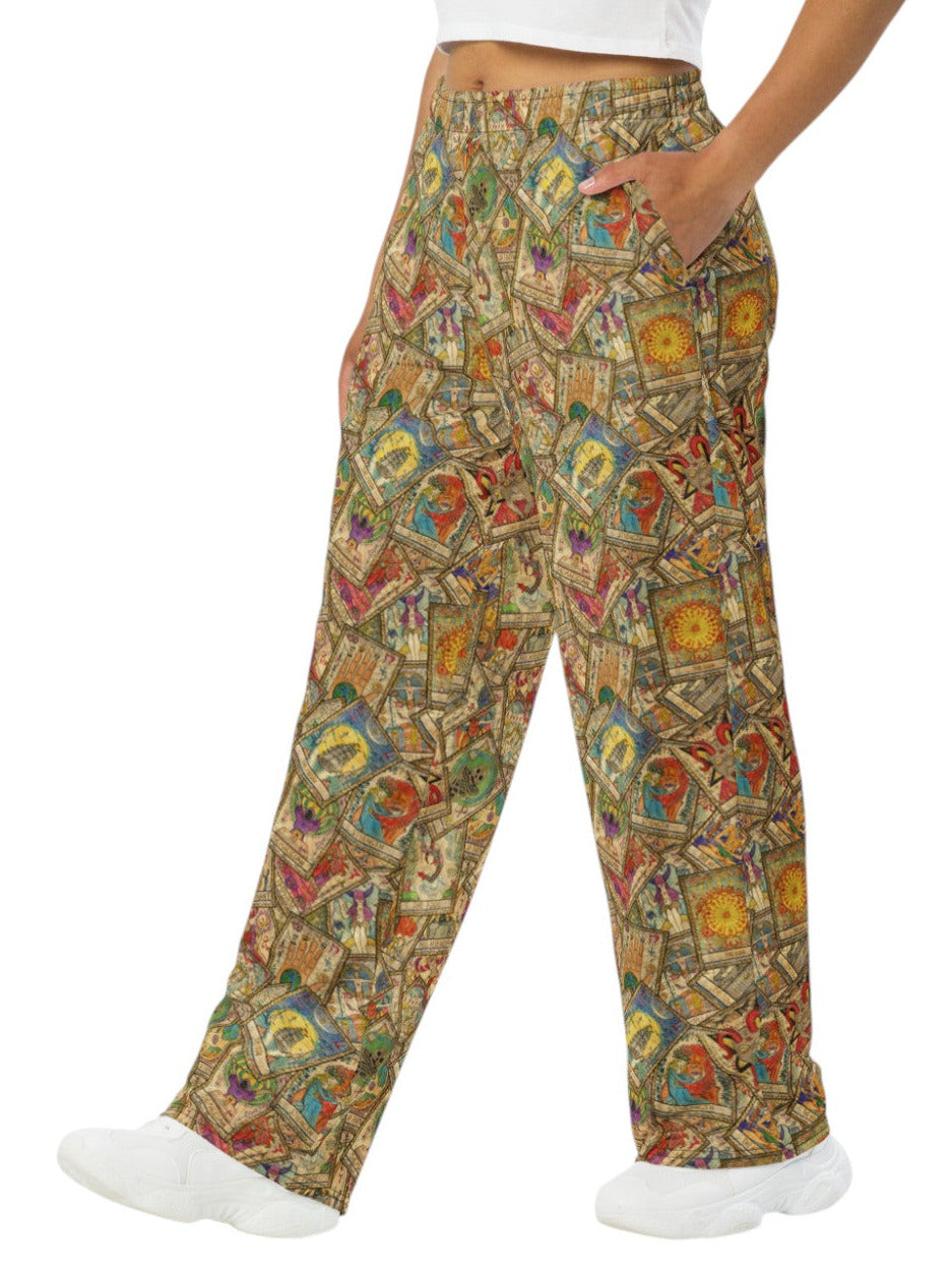 Woman wearing Whimsigoth wide leg lounge pants with vintage tarot card print and practical side pockets.
