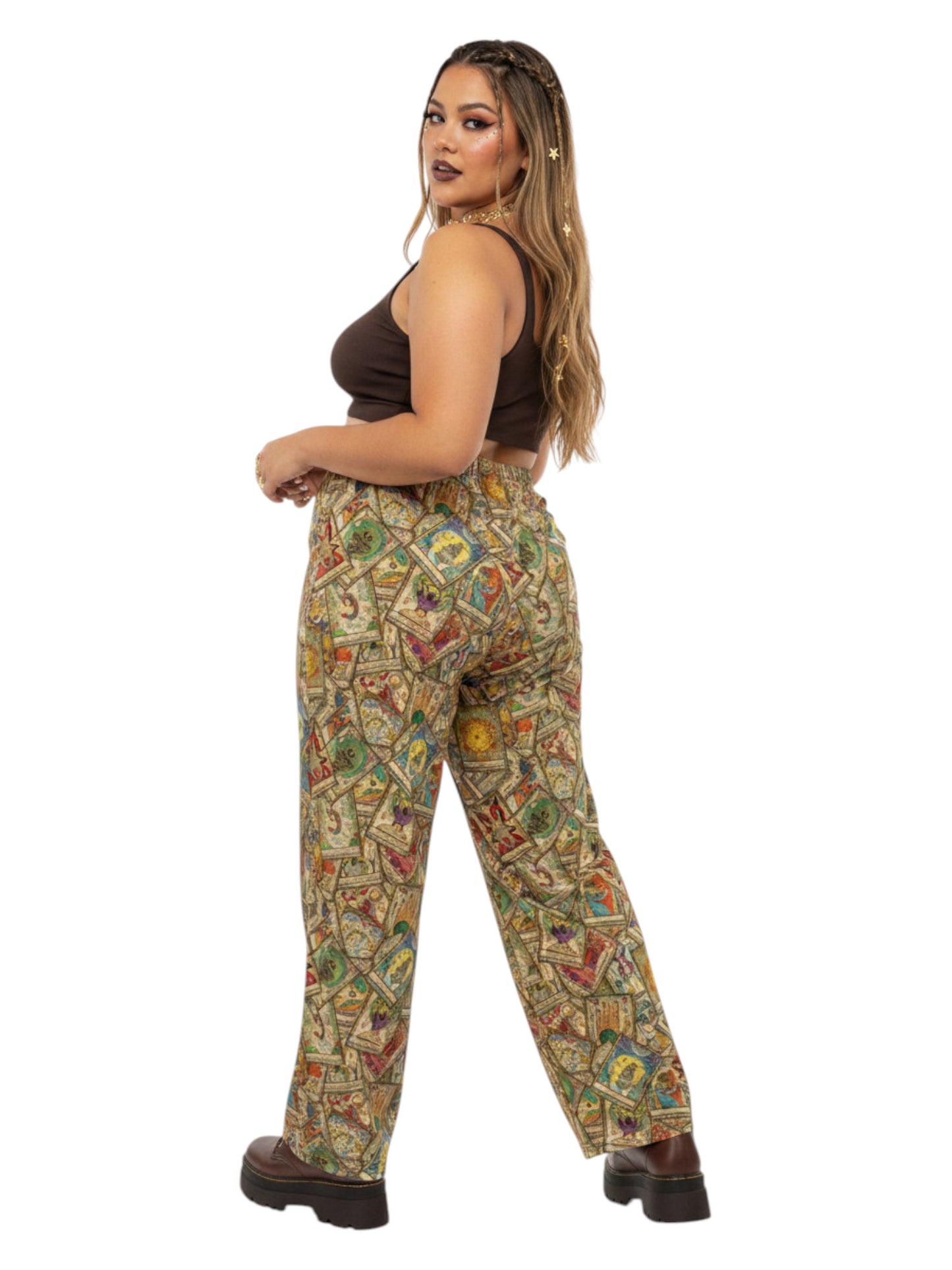 Woman wearing Whimsigoth wide leg lounge pants with vintage tarot card print and practical side pockets.
