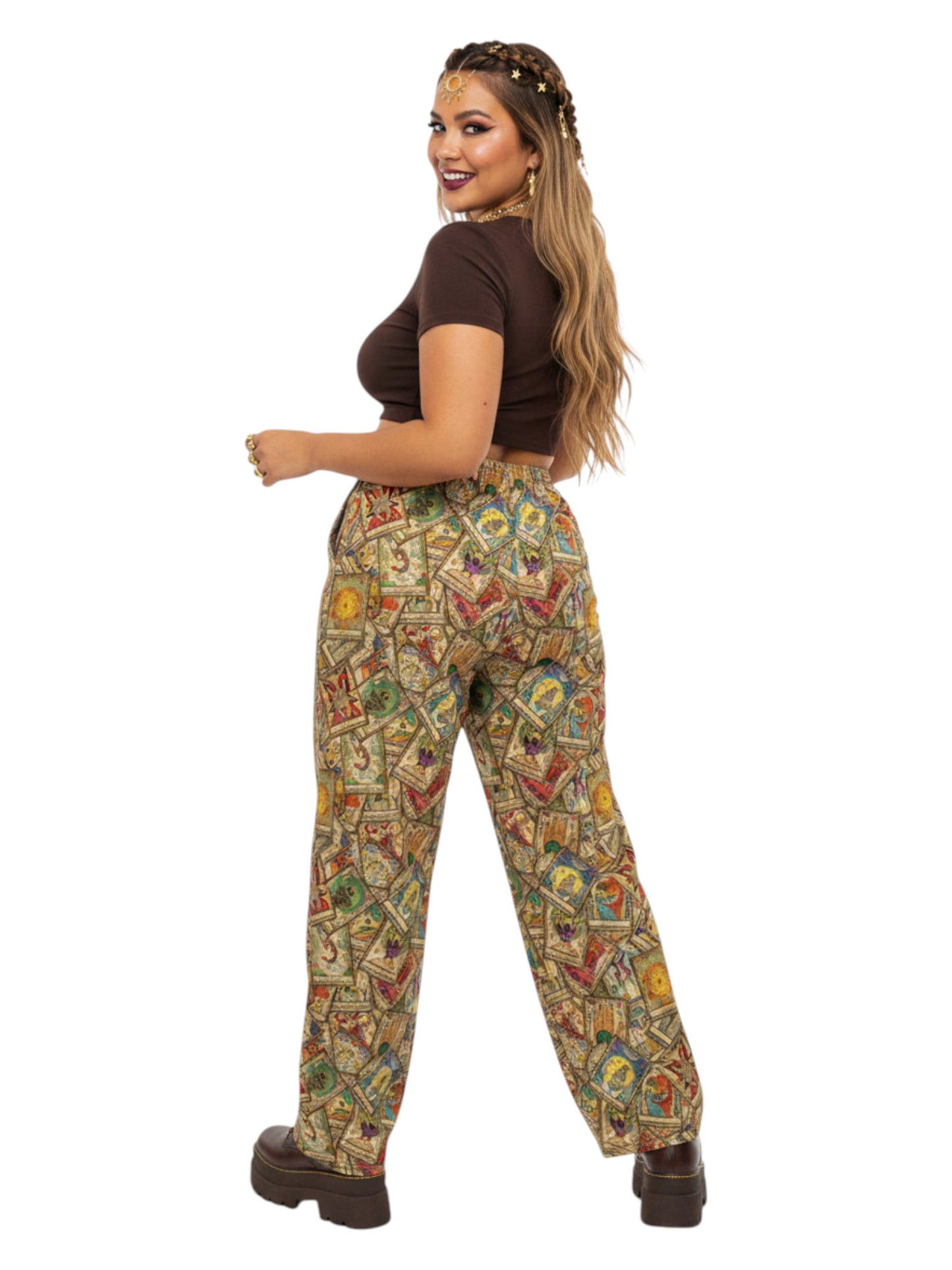 Woman wearing Whimsigoth wide leg lounge pants with vintage tarot card print and practical side pockets.