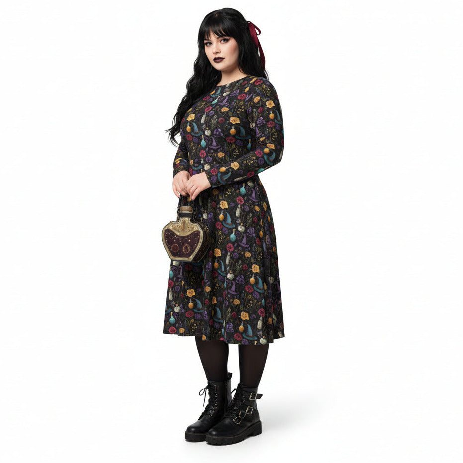 Woman wearing a dark floral dress holding a handbag on a white background