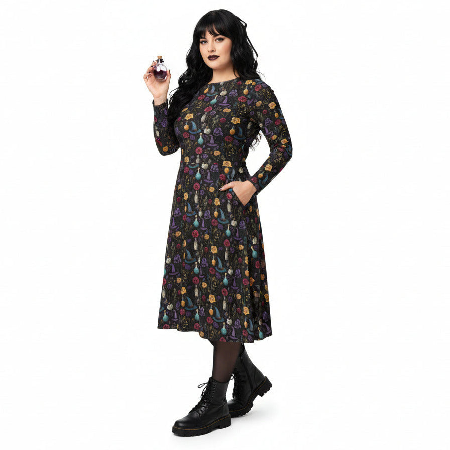 Woman wearing a black dress with colorful floral pattern on a white background
