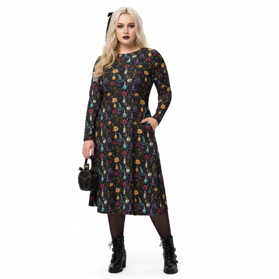 Woman wearing a black dress with colorful floral pattern on a white background