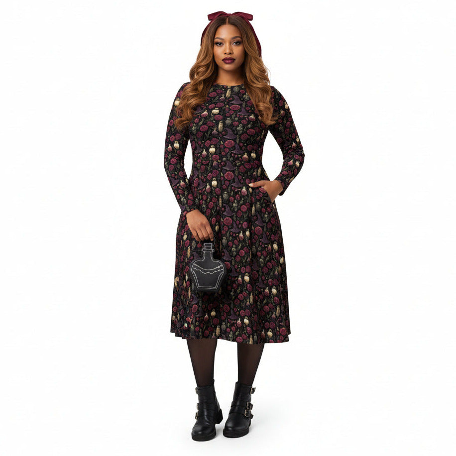 Woman wearing a floral dress with long sleeves on a white background