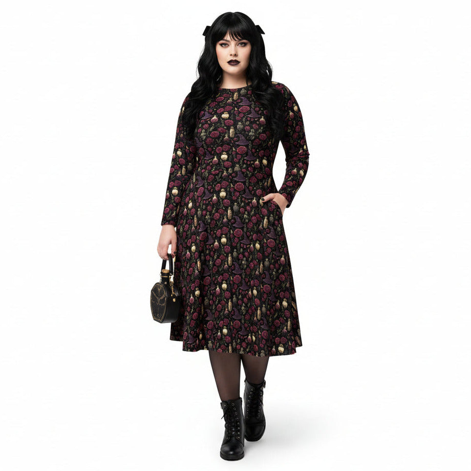 Woman wearing a dark floral dress on a white background
