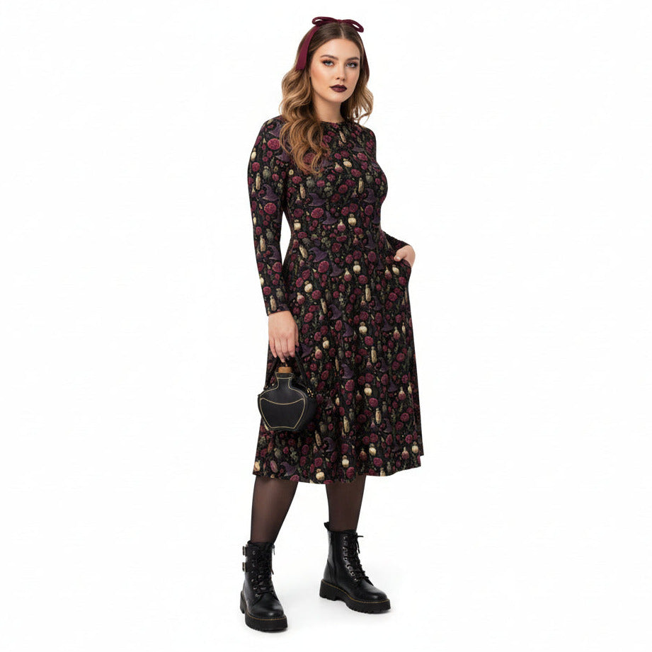 Woman wearing a floral dress with black boots on a white background