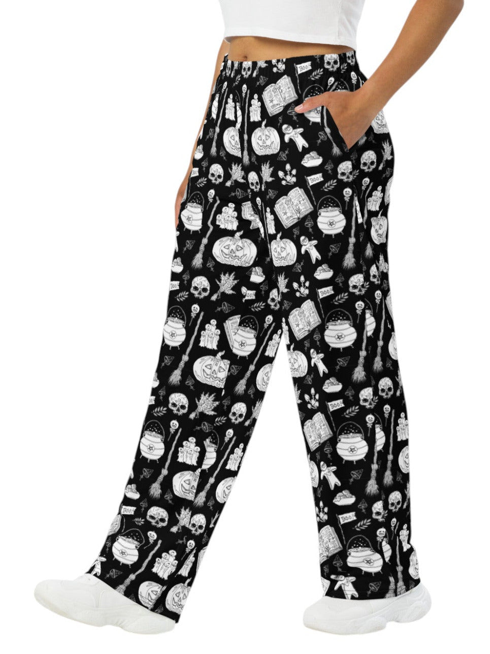 Woman wearing black and white witchy voodoo doll print wide leg lounge pants with side pockets.