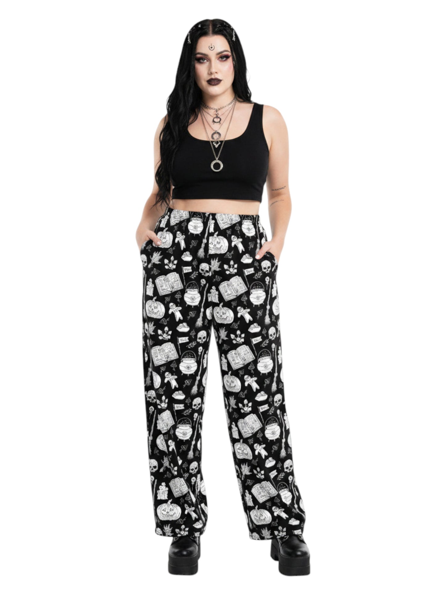 Woman wearing black and white witchy voodoo doll print wide leg lounge pants with side pockets.