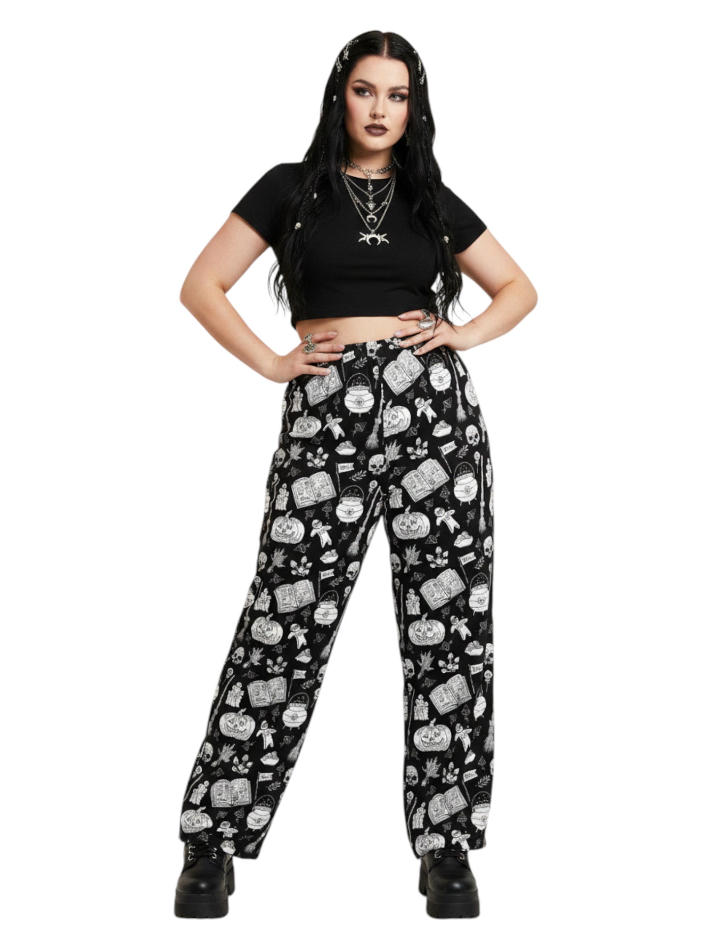 Woman wearing black and white witchy voodoo doll print wide leg lounge pants with side pockets.