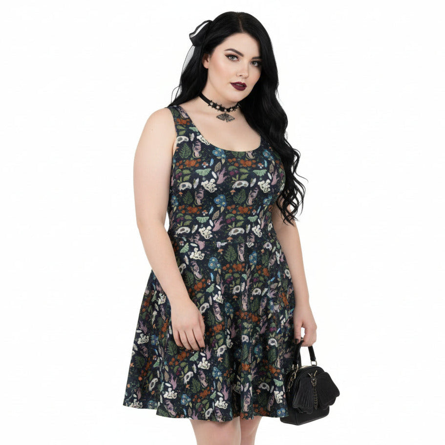 Woman wearing a floral dress on a white background
